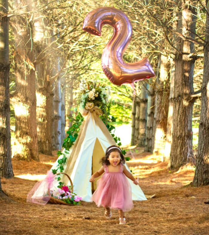 Young girl with number ballon