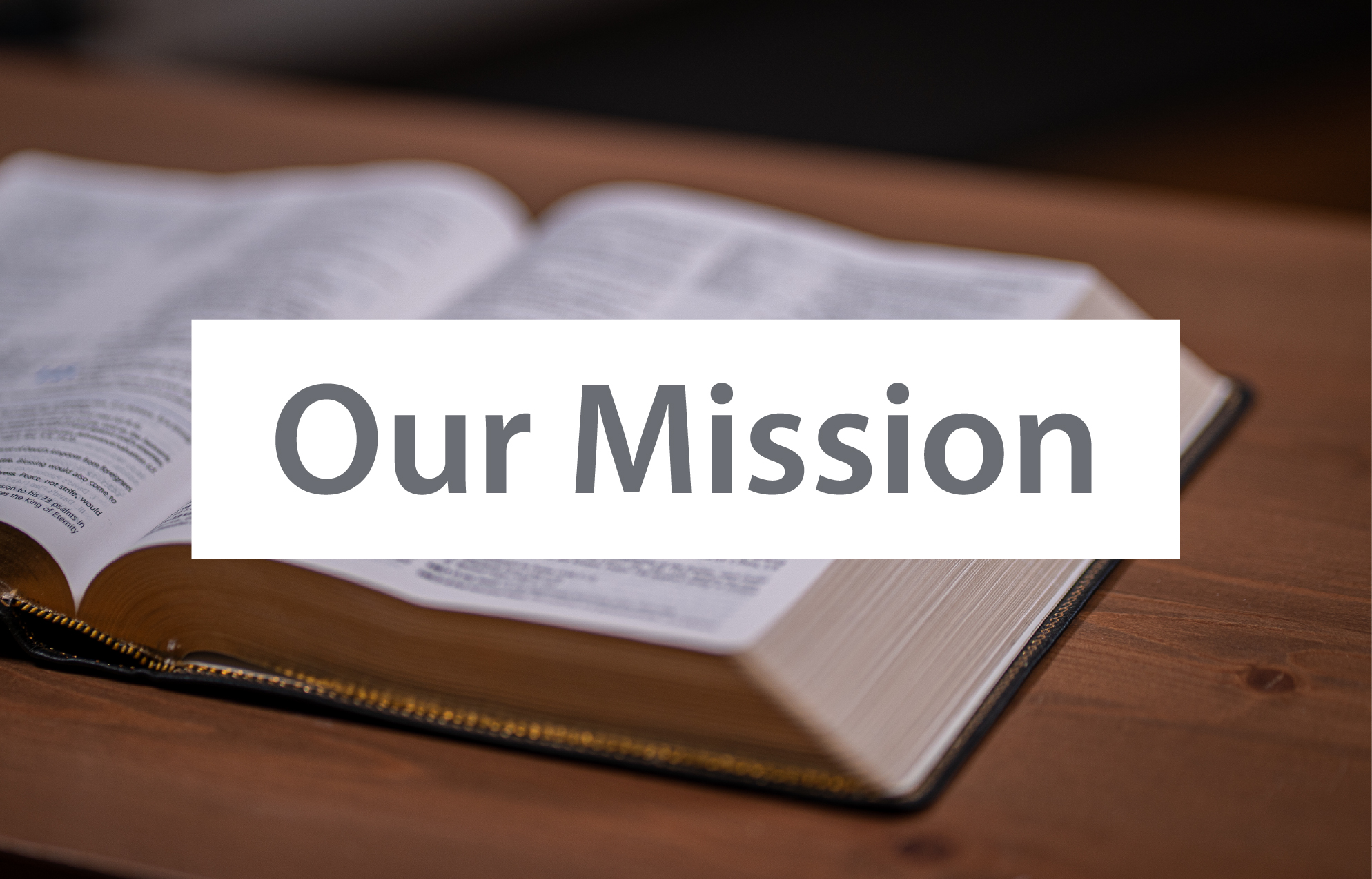 Open Bible on a table with overlayed text